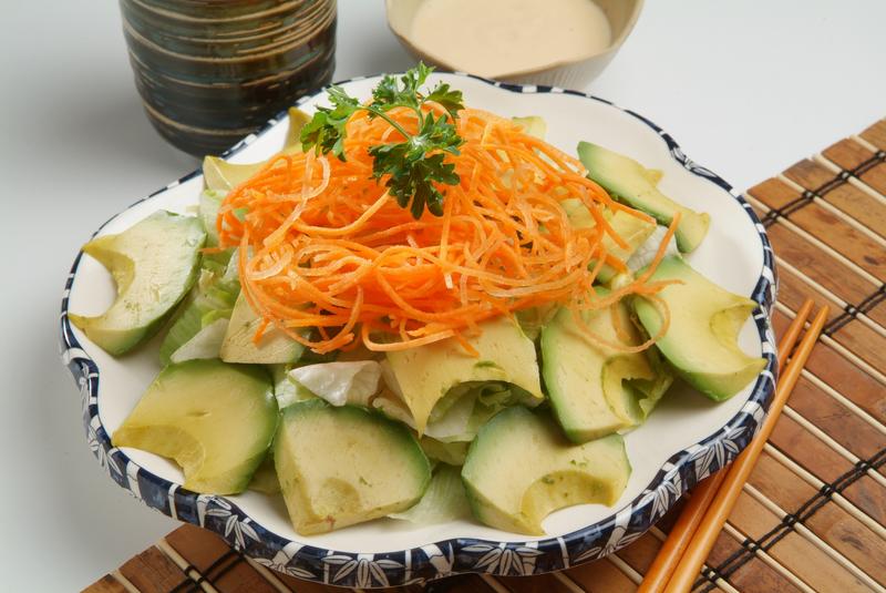 Avocado & lettuce garnished with carrot strands & parsley on top